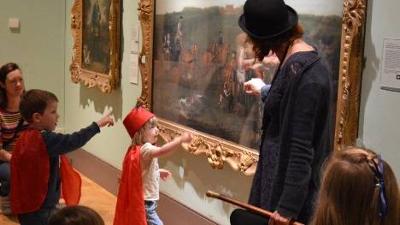 Children looking at art display