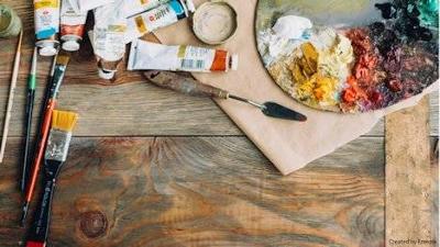 Artists palette and paints on a table