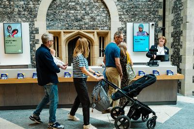 Family entering reception area with pushchair