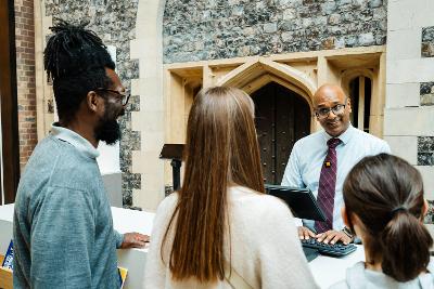Family paying for admission in reception area