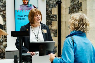 Member of public speaking to member of staff in reception
