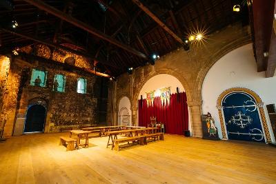 Enormous empty hall with vaulted ceiling in castle