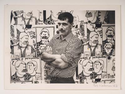 David Shenton poses by illustrations